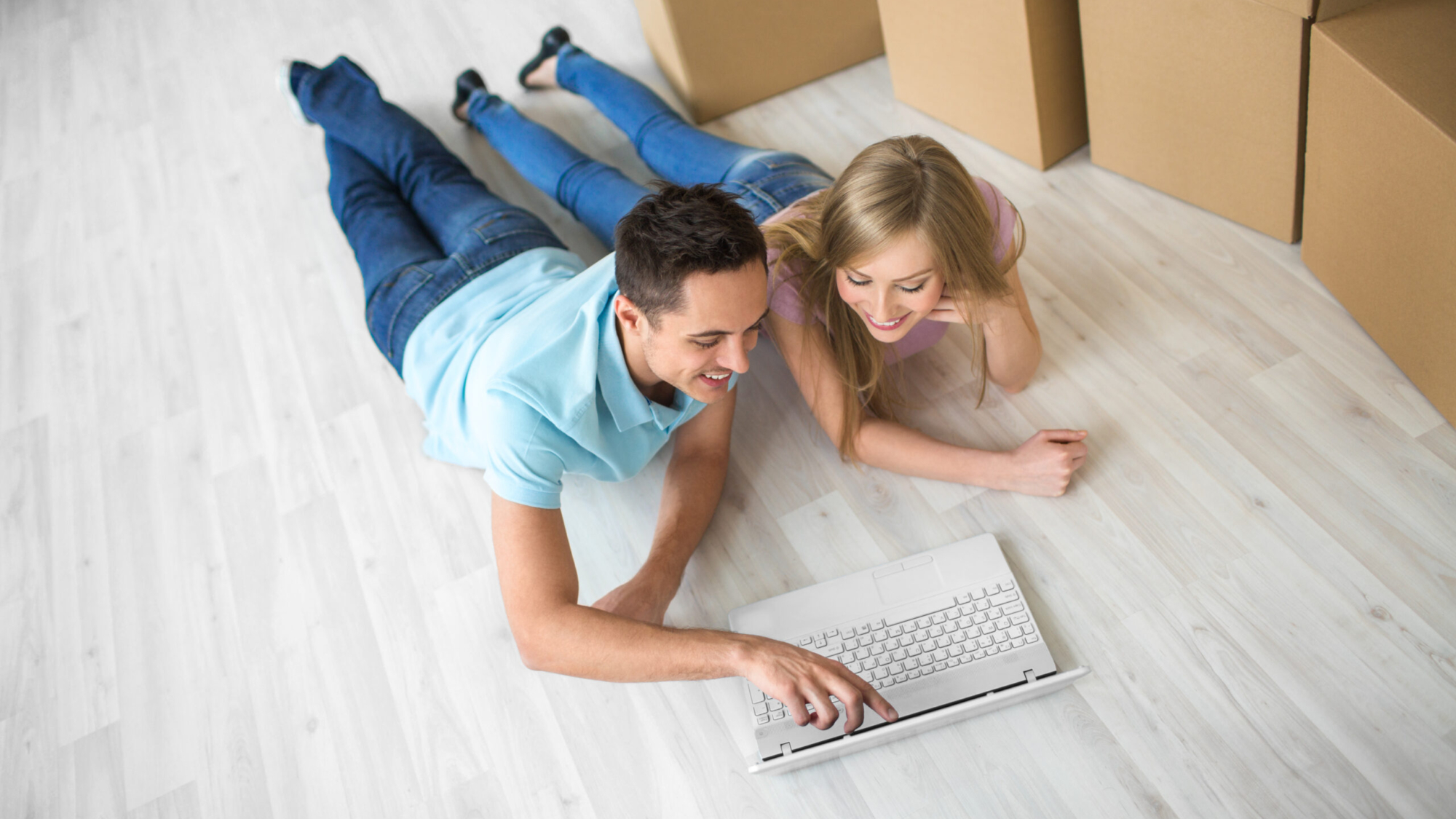 Young attractive couple with laptop